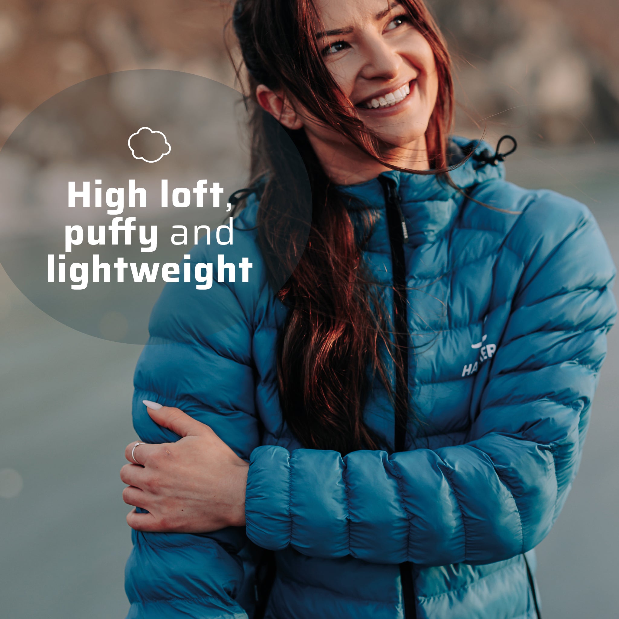A woman wearing the thermal jacket, she is smiling.