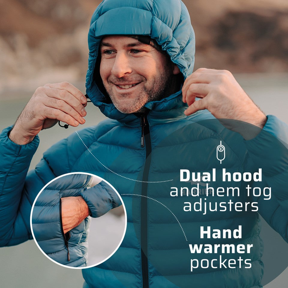 A man wearing the thermal jacket. He has the hood up and is adjusting it using the togs. He is smiling.