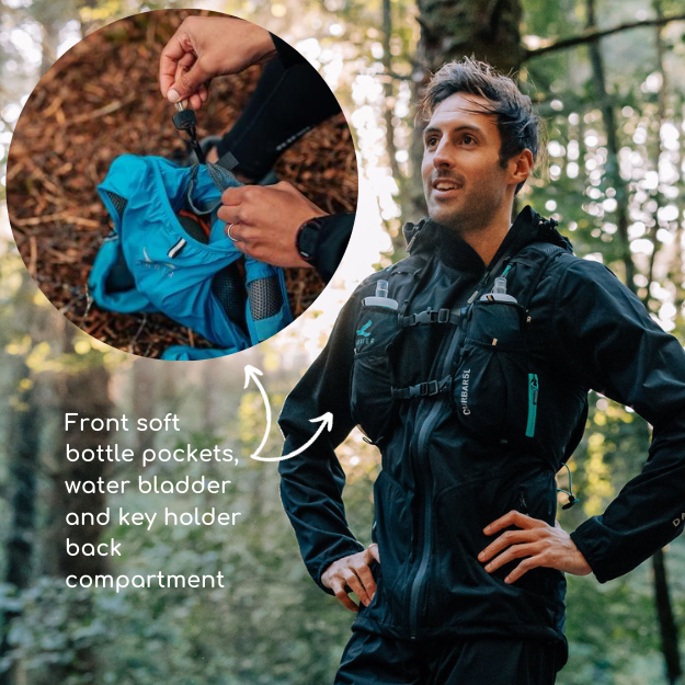 A man wearing a running hydration vest with soft bottles in the front pockets and a water bladder in the back pocket. 