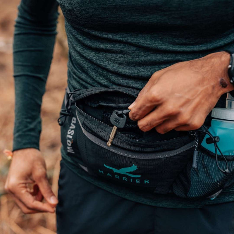 Close up of a key clipped inside the waist bag.